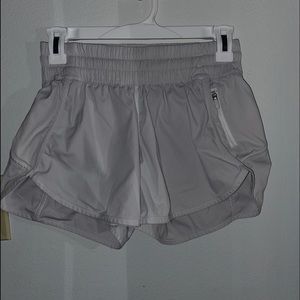WHITE LULULEMON TRACKER SHORTS